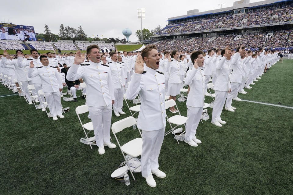 Graduating midshipmen take their oath during the U.S. Naval Academy's graduation and commissioning ceremony at the Navy-Marine Corps Memorial Stadium in Annapolis, Md., Friday, May 27, 2022. (AP Photo/Susan Walsh)