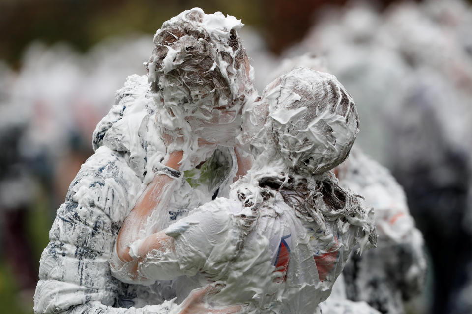 <p>Students from St Andrews University are covered in foam as they take part in the traditional “Raisin Weekend” on the Lower College Lawn, at St Andrews, Scotland, Oct. 23, 2017. (Photo: Russell Cheyne/Reuters) </p>