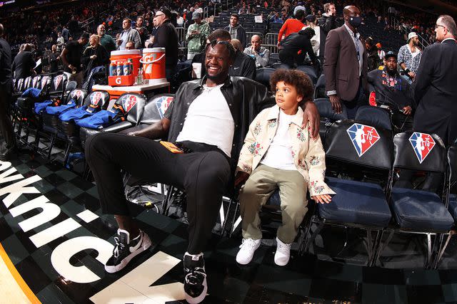 <p>Nathaniel S. Butler/NBAE/Getty</p> Julius Randle of the New York Knicks looks on and smiles with Kyden before the game against the Brooklyn Nets at Madison Square Garden in New York City on April 6, 2022.