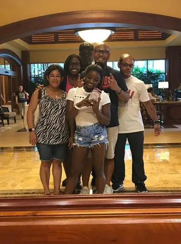 <p>Simone Biles/Instgaram</p> Simone Biles with her siblings Adam, Adria, and Ron, and parents Nellie and Ron.