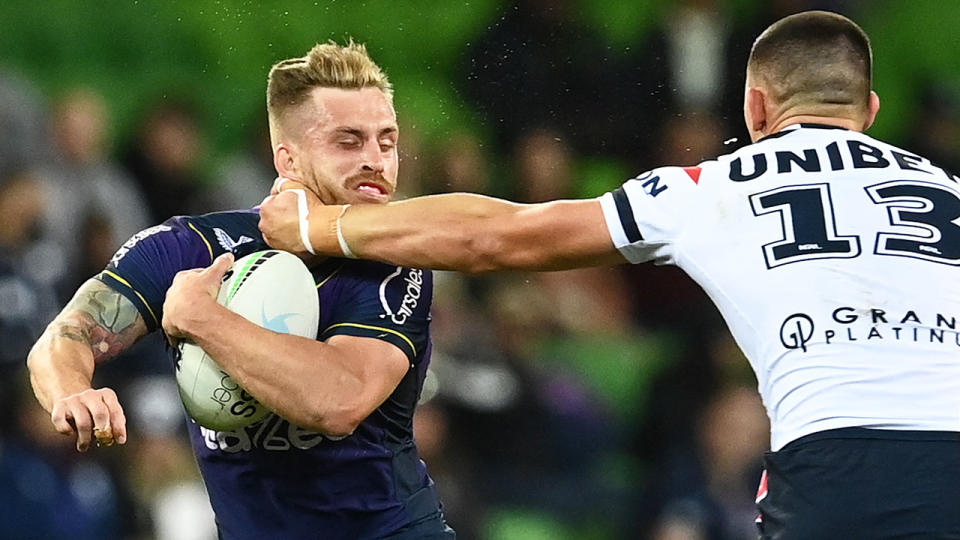 Victor Radley is seen here hitting Cameron Munster with a high shot in the Roosters' loss to the Storm.