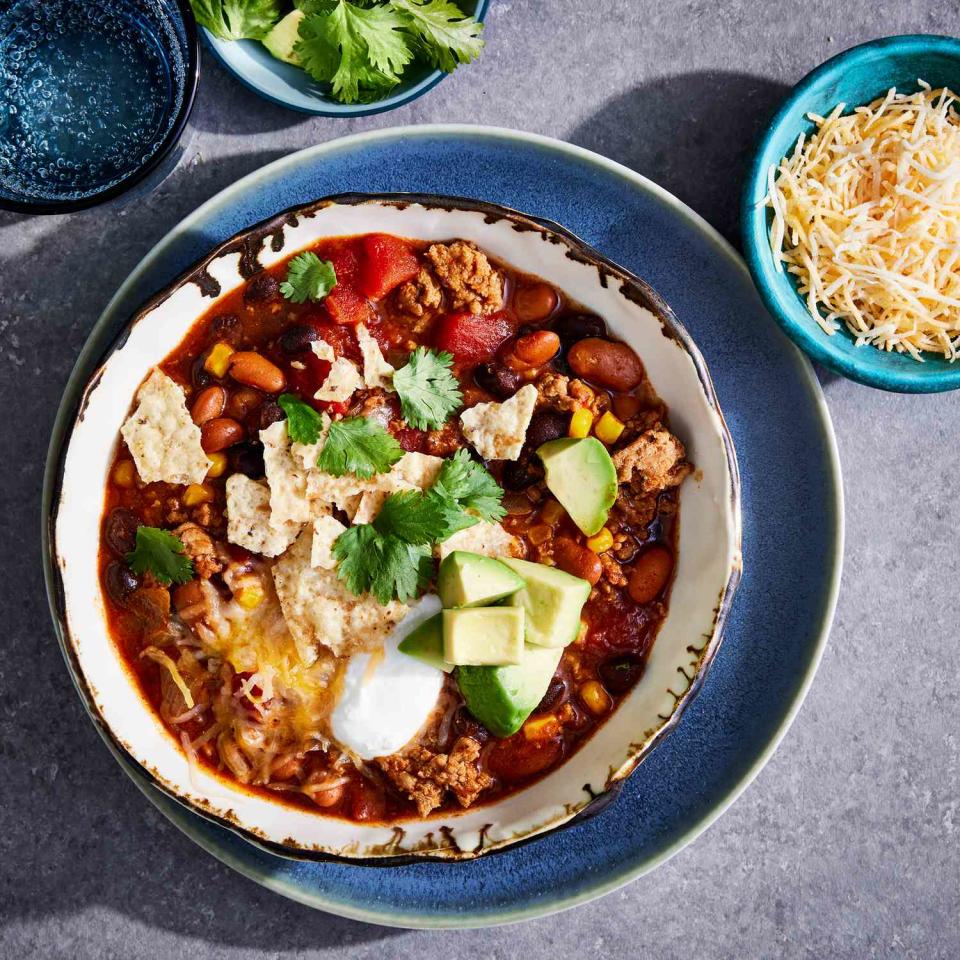 <p>This easy-to-make taco soup features enchilada sauce and taco seasoning, which provides a mild heat. Top this family-friendly soup with all of your favorite taco garnishes.</p> <p> <a href="https://www.eatingwell.com/recipe/8020846/everyones-favorite-taco-soup/" rel="nofollow noopener" target="_blank" data-ylk="slk:View Recipe" class="link ">View Recipe</a></p>