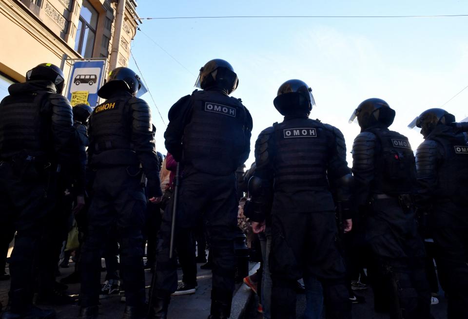 Police officers block a street in Saint Petersburg 