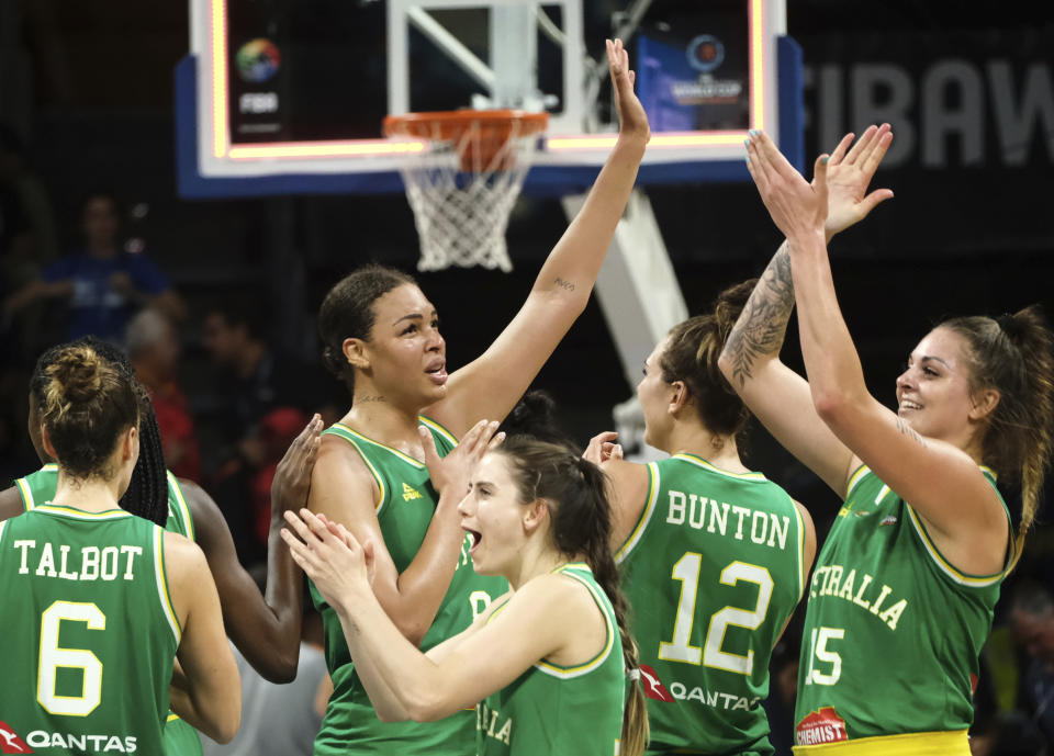 The Australian team celebrate their victory over Spain, in the Women's basketball World Cup semi final match between Spain and Australia in Tenerife, Spain, Saturday Sept. 29, 2018. (AP Photo Andres Gutierrez)