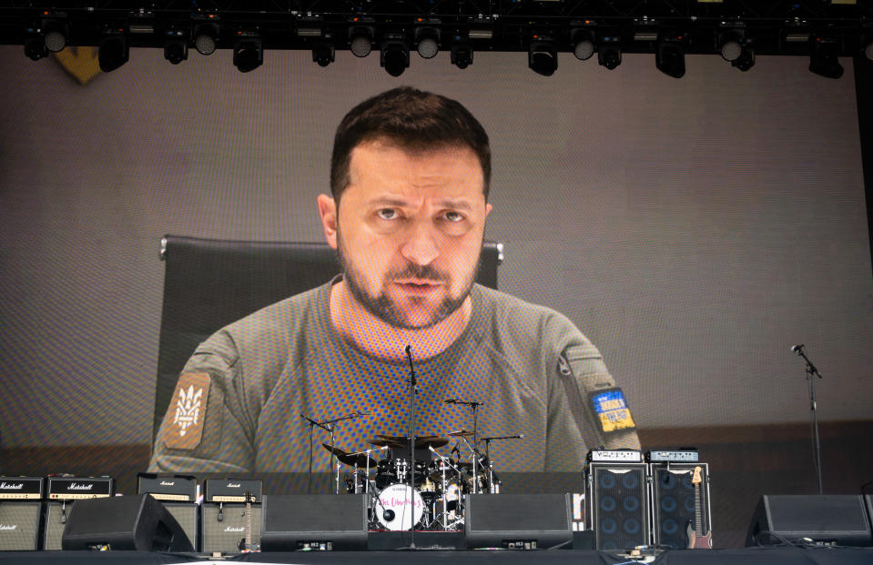 GLASTONBURY, ENGLAND - JUNE 24:  Ukrainian president Volodymyr Zelensky addresses the crowd via a video recording on the Other stage during day three of Glastonbury Festival at Worthy Farm, Pilton on June 24, 2022 in Glastonbury, England.  during day three of Glastonbury Festival at Worthy Farm, Pilton on June 24, 2022 in Glastonbury, England. (Photo by Samir Hussein/WireImage)