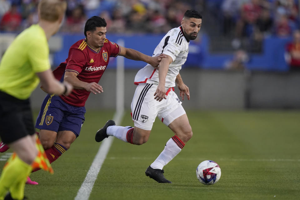 FC Dallas midfielder Sebastian Lletget, right, handles the ball against Real Salt Lake defender Brayan Vera during the first half of an MLS soccer match Saturday, April 15, 2023, in Frisco, Texas. (AP Photo/LM Otero)