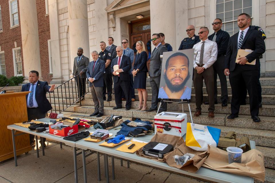 York City Detective Andy Baez, left, describes the cache of weapons, some untraceable, and a safe filled with cash that were found in the home Jaquez Brown, pictured, was living in when he was arrested for York's latest homicide.