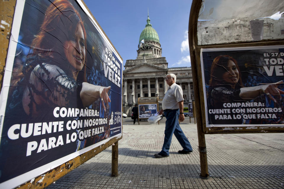 A sign of Argentina's President Cristina Fernandez that reads in Spanish "Companion, count on us for what's left" covers a bus stop outside Congress where a bill proposed by Fernandez to gain control of Argentina's energy reserves is being discussed in Buenos Aires, Argentina, Tuesday April 17, 2012. Fernandez pushed forward a bill to renationalize the country's largest oil company on Monday despite fierce criticism from abroad and the risk of a major rift with Spain. Fernandez said the legislation put to congress would give Argentina a majority stake in oil and gas company YPF by taking control of 51 percent of its shares currently held by Spain's Repsol. (AP Photo/Natacha Pisarenko)