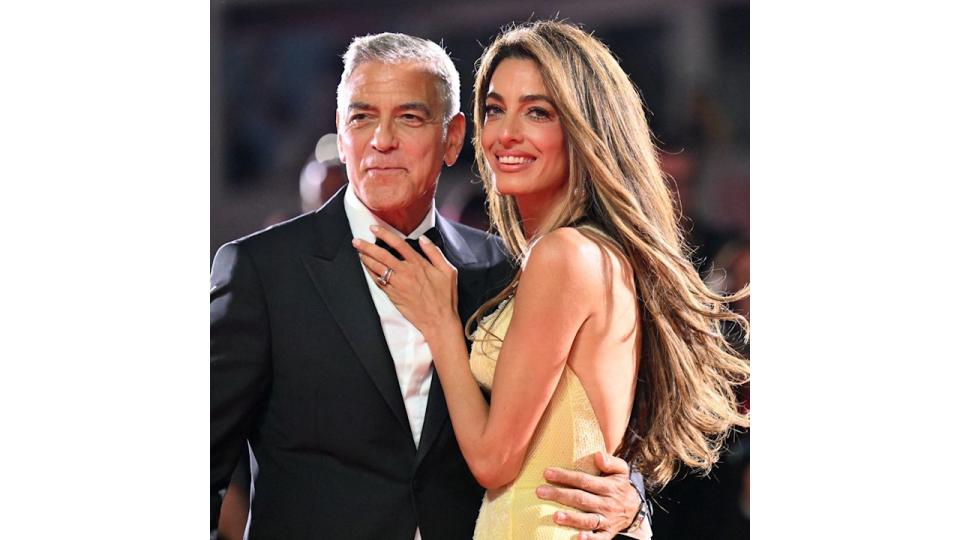 George Clooney and his wife Amal Clooney attend the red carpet of the movie "Wolfs" presented out of competition during the 81st International Venice Film Festival at Venice Lido, on September 1, 2024