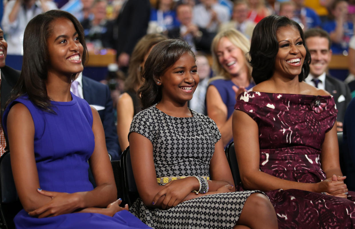 Malia, Sasha and Michelle Obama listen as then-President Barack Obama speaks at the Democratic National Convention in 2012. (Photo: Chip Somodevilla via Getty Images)