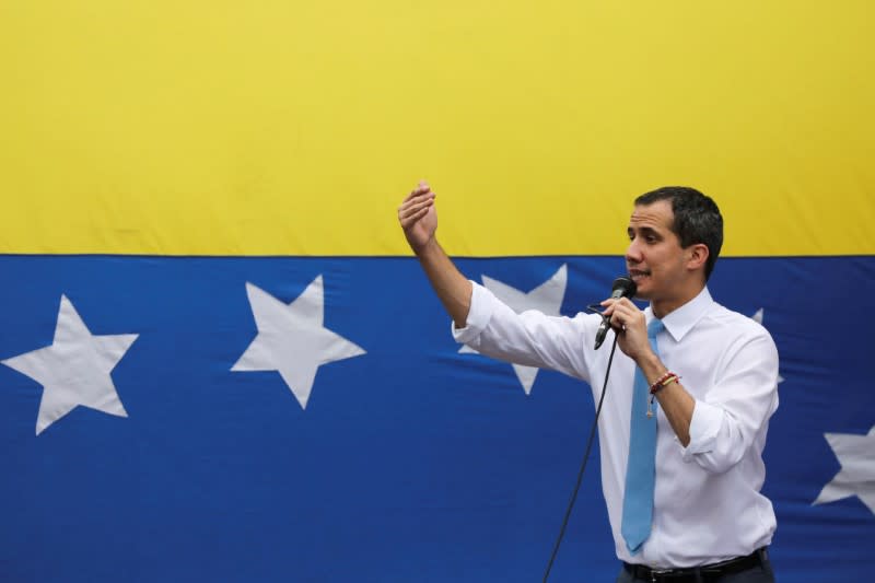 FILE PHOTO: Venezuela's National Assembly President and opposition leader Juan Guaido, who many nations have recognised as the country's rightful interim ruler, gestures as he speaks during a demonstration in Caracas