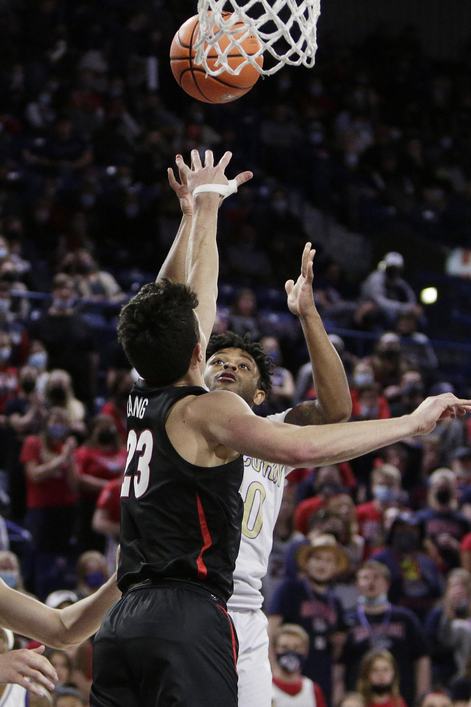 Alcorn State guard Paul King, right, shoots over Gonzaga guard Matthew Lang during the second half of an NCAA college basketball game, Monday, Nov. 15, 2021, in Spokane, Wash. (AP Photo/Young Kwak)