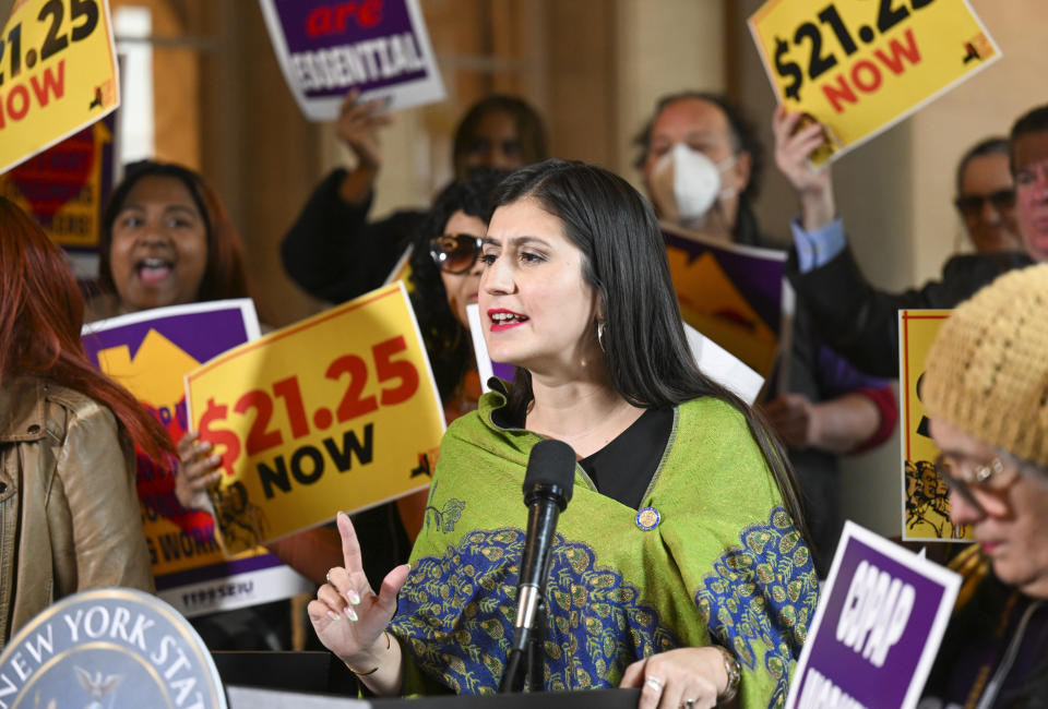 New York Sen. Jessica Ramos, D-East Elmhurst, stands with protesters urging lawmakers to raise New York's minimum wage during a rally at the state Capitol, Monday, March 13, 2023, in Albany, N.Y. (AP Photo/Hans Pennink)