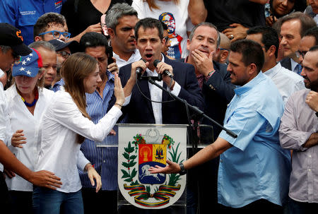 FILE PHOTO: Venezuelan opposition leader Juan Guaido, who many nations have recognized as the country's rightful interim ruler, talks to supporters during a rally against Venezuelan President Nicolas Maduro's government in Caracas, Venezuela March 4, 2019. REUTERS/Carlos Garcia Rawlins/File Photo