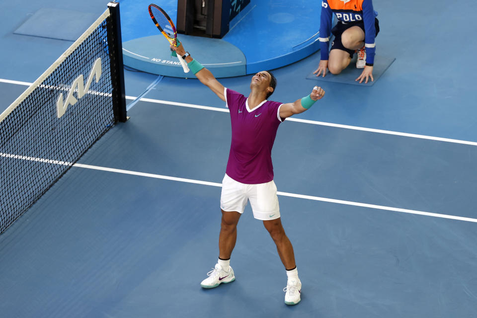 Rafael Nadal of Spain celebrates after defeating Denis Shapovalov of Canada in their quarterfinal match at the Australian Open tennis championships in Melbourne, Australia, Tuesday, Jan. 25, 2022.(AP Photo/Tertius Pickard)