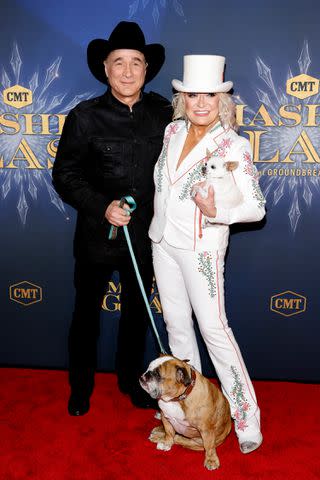 <p>Jason Kempin/Getty</p> Clint Black and Tanya Tucker (with her two dogs) in Nashville on Oct. 26, 2023