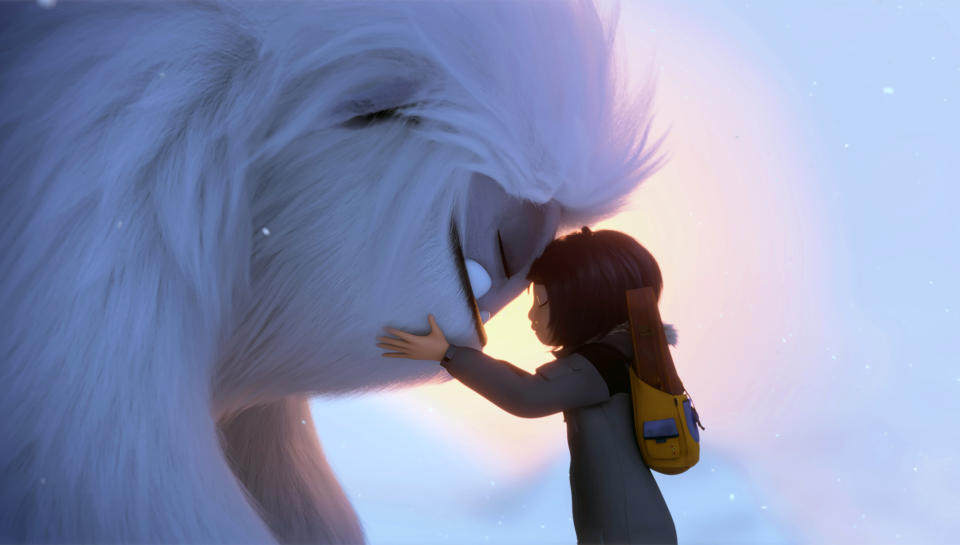 This image released by DreamWorks Animation shows Everest the Yeti, left, and Yi, voiced by Chloe Bennet, in a scene from "Abominable," in theaters on Sept. 27. (DreamWorks Animation LLC. via AP)