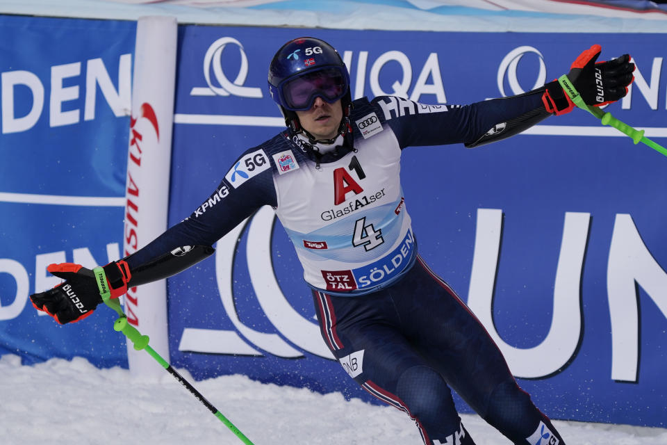 Norway's Henrik Kristoffersen reacts after crossing the finish line to complete an alpine ski, men's World Cup giant slalom, in Soelden, Austria, Sunday, Oct. 23, 2022. (AP Photo/Giovanni Auletta)