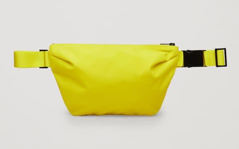 Luke's orange Flagstuff cross-body bag is now sold out at Goodhood.com. Similar alternatives, like this bag, £39, from Cos, are available.