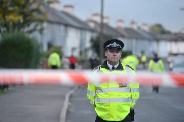 Police officers taking part in an operation in Cavendish Road, Sunbury-on-Thames