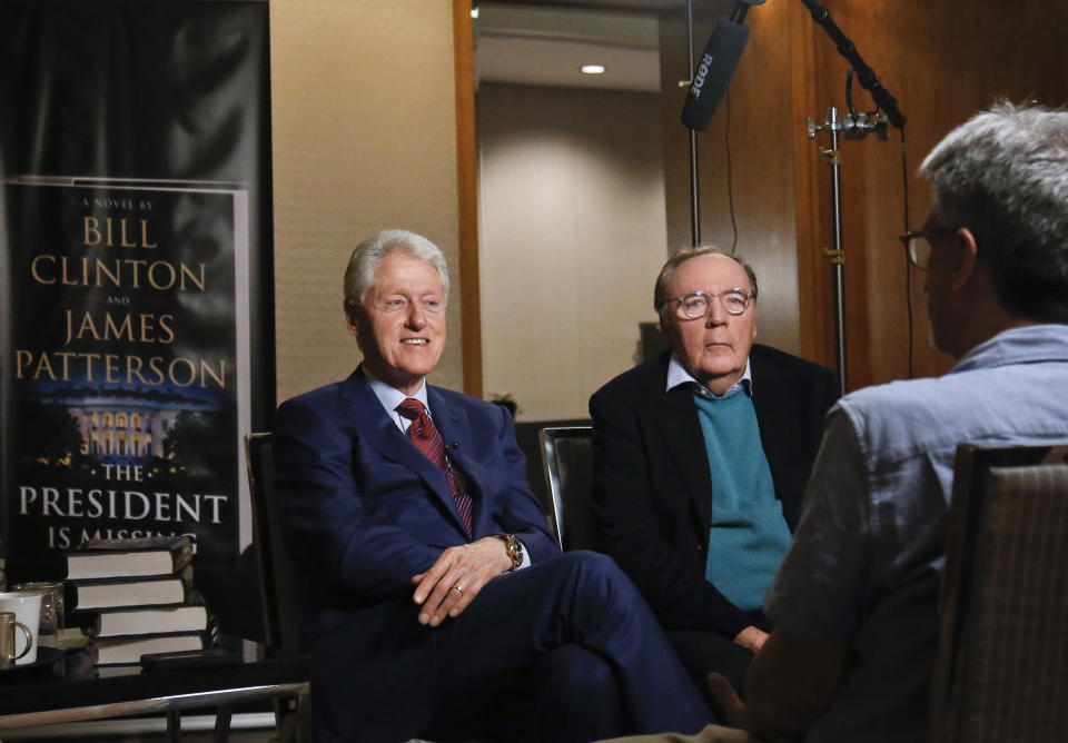 FILE - In this Monday, May 21, 2018, file photo, former President Bill Clinton, left, and author James Patterson speak during an interview about their novel, "The President is Missing," in New York. Clinton and Patterson are teaming up again with “The President's Daughter," to be released in June 2021, the book's publishers announced Thursday. (AP Photo/Bebeto Matthews, File)