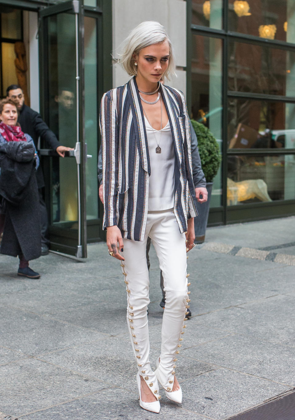 Wearing a stripy jacket and white jeans out and about in New York in March 2017