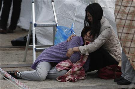 A relative of a missing passenger onboard the capsized Sewol ferry cries at a port in Jindo April 26, 2014. REUTERS/Kim Kyung-Hoon