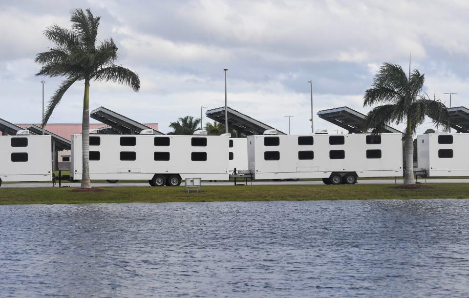 Sleeping quarters for workers begin to arrive at American Muscle Car Museum in Melbourne on Thursday for electrical workers who will restore power to Floridians affected by Hurricane Nicole.