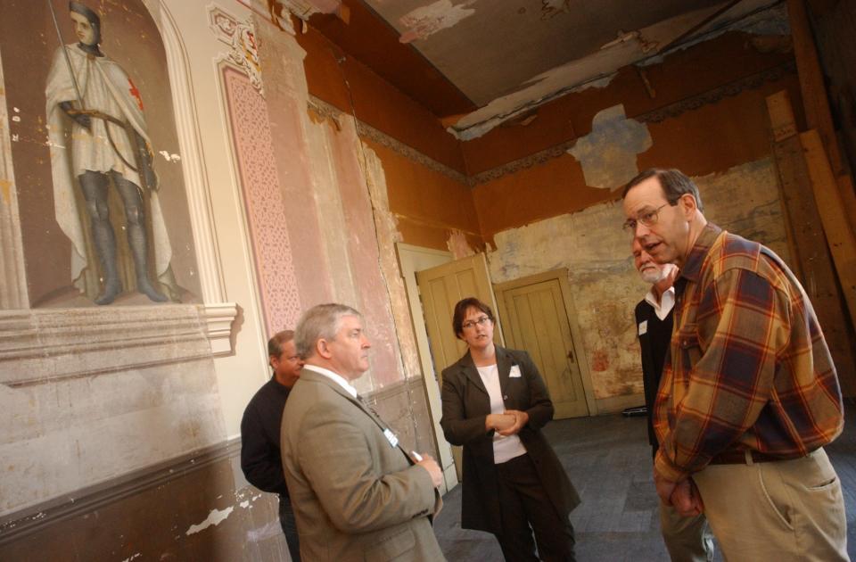 Jim Lambert, assistant dean for development at Ohio University-Chillicothe, left, Priscilla Smith, president of the Majestic Theatre, David Uhrig, board member, discuss the future of the theater in the ballroom with Gov. Bob Taft, in downtown Chillicothe. In April 2004, then Ohio Governor Bob Taft visited Chillicothe where he made stops at the Majestic Theatre, which was beginning a renovation project, and also the Ross County Historical Society, which had recently completed a renovation.