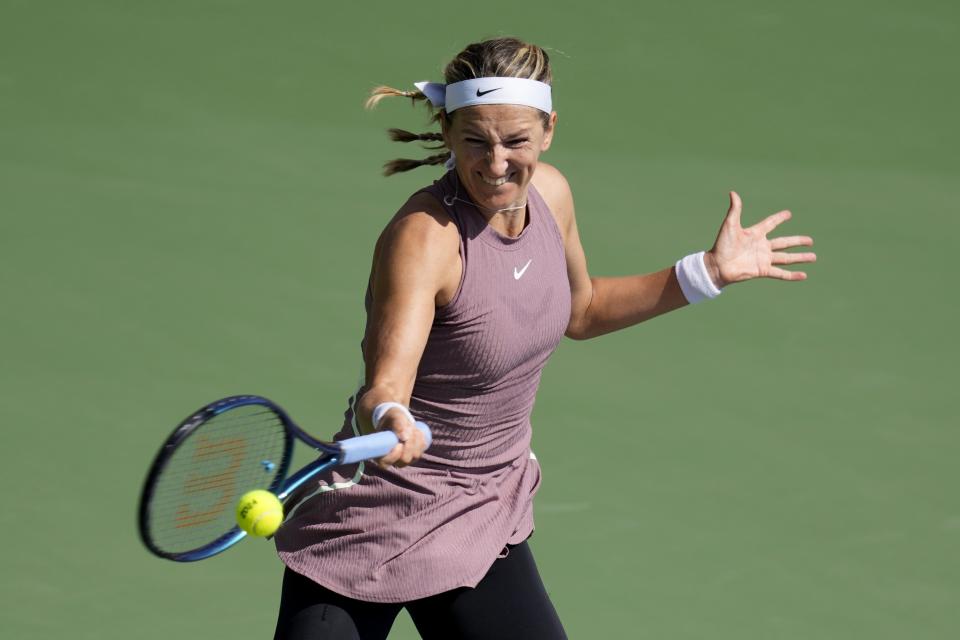 Victoria Azarenka returns the ball to Arantxa Rus of Netherlands during a match of the Dubai Duty Free Tennis Championships in Dubai, United Arab Emirates, Monday, Feb. 19, 2024. (AP Photo/Kamran Jebreili)