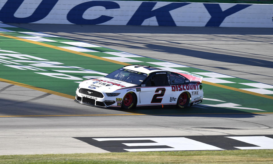 Brad Keselowski crosses the finish line during qualifying for a NASCAR Series auto race at Kentucky Speedway in Sparta, Ky., Friday, July 12, 2019. (AP Photo/Timothy D. Easley)