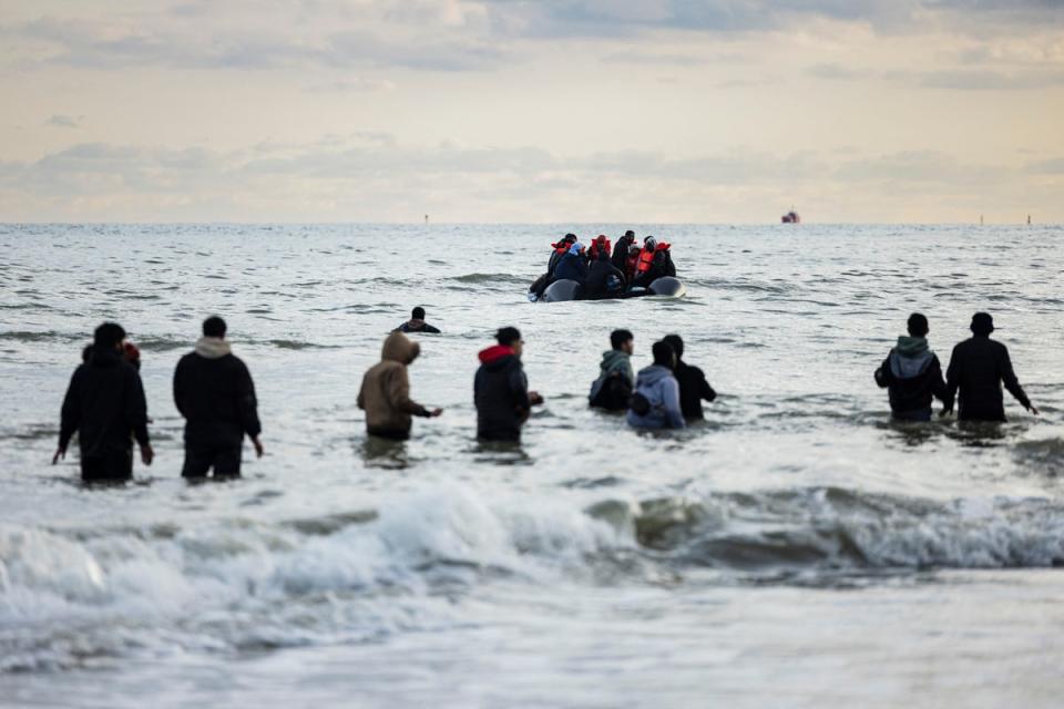 Migrants board a smuggler's boat on the beach at Gravelines, near Dunkirk, (Getty)