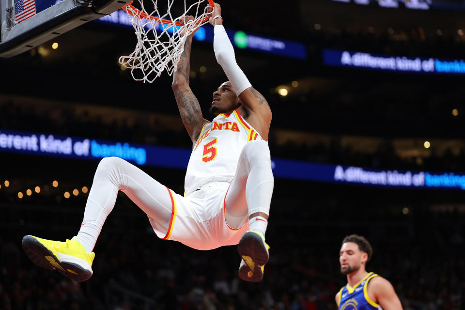 ATLANTA, GEORGIA - FEBRUARY 03:  Dejounte Murray #5 of the Atlanta Hawks dunks against the Golden State Warriors during the first quarter at State Farm Arena on February 03, 2024 in Atlanta, Georgia.  NOTE TO USER: User expressly acknowledges and agrees that, by downloading and/or using this photograph, user is consenting to the terms and conditions of the Getty Images License Agreement.  (Photo by Kevin C. Cox/Getty Images)