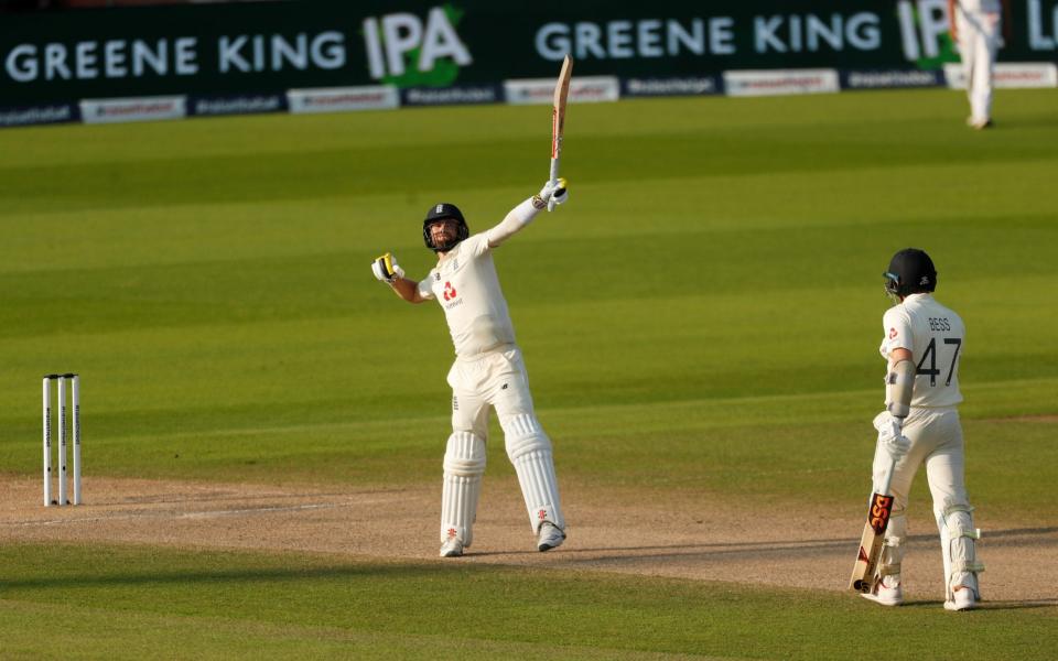 Chris Woakes celebrates after edging the winning runs through the slips - Reuters