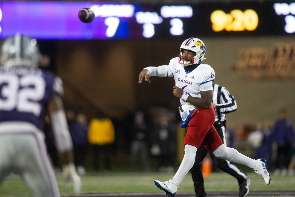 Kansas junior quarterback Jalon Daniels (6) throws a pass midair during the first quarter of Saturday's Sunflower Showdown against Kansas State at Bill Snyder Family Stadium.