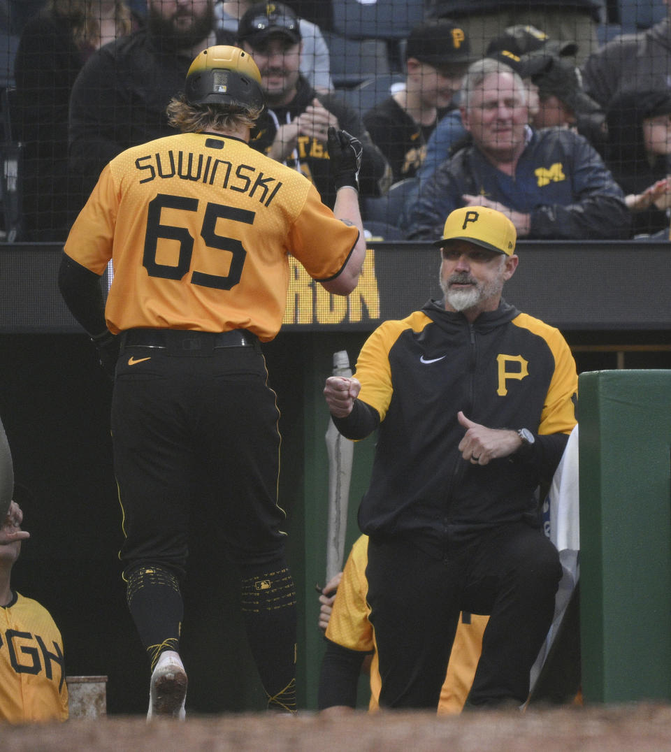 Pittsburgh Pirates' Jack Suwinski is met at the dugout by manager Derek Shelton after hitting a solo home run against the San Diego Padres during the third inning of a baseball game Tuesday, June 27, 2023, in Pittsburgh. (AP Photo/Justin Berl)