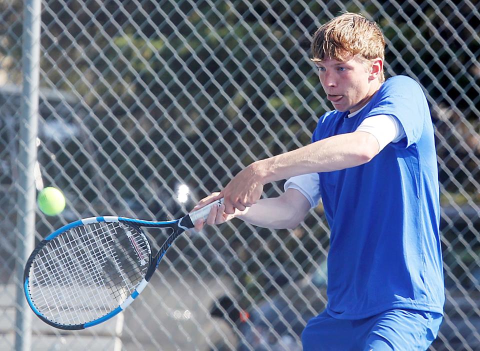 Aberdeen Central's Preston Kreber hits a return shot in a fifth-flight singles match during the Eastern South Dakota Conference boys tennis tournament on Tuesday, May 9, 2023 in Mitchell.