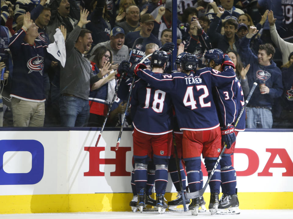 Columbus Blue Jackets' players celebrate their goal against the Tampa Bay Lightning during the second period of Game 3 of an NHL hockey first-round playoff series Sunday, April 14, 2019, in Columbus, Ohio. (AP Photo/Jay LaPrete)