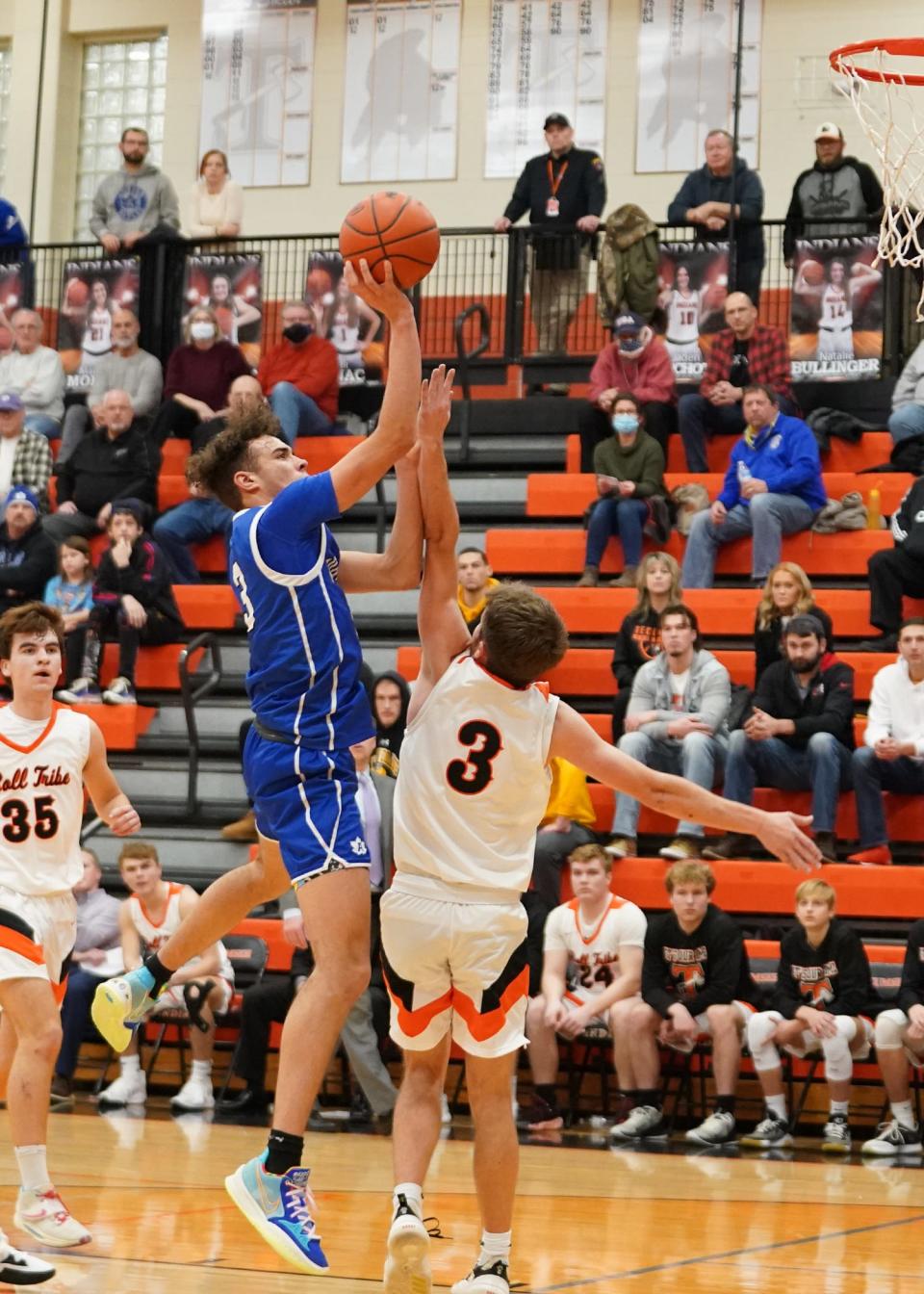 Adrian's Joe Francis goes up for a shot during Friday's game at Tecumseh.