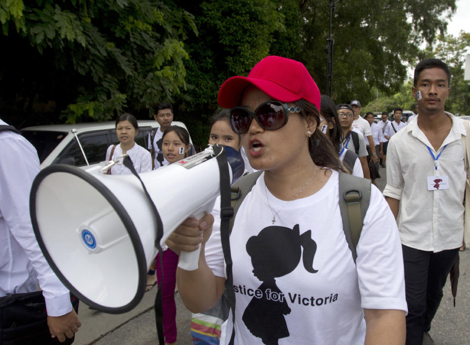 A woman shouts slogans with a loud speaker as they march during a protest in Yangon, Myanmar Saturday, July 6, 2019. Hundreds of people marched to Myanmar’s Central Investigation Department on Saturday in Yangon to demand justice for a 2-year-old girl who was allegedly raped in the country’s capital in May. (AP Photo/Thein Zaw)