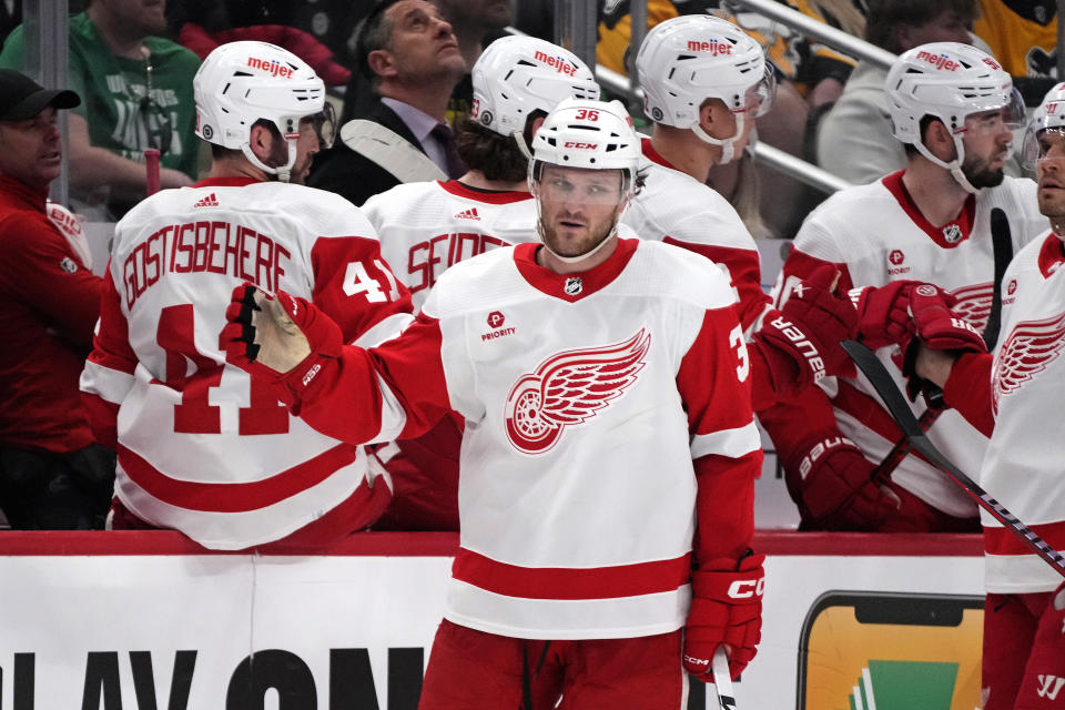 Detroit Red Wings' Christian Fischer (36) returns to his bench after scoring during the second period of an NHL hockey game against the Pittsburgh Penguins in Pittsburgh, Sunday, March 17, 2024. (AP Photo/Gene J. Puskar)