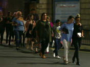 <p>Members of the public are escorted from the Manchester Arena on May 23, 2017 in Manchester, England. There have been reports of explosions at Manchester Arena where Ariana Grande had performed this evening. Greater Manchester Police have have confirmed there are fatalities and warned people to stay away from the area. (Dave Thompson/Getty Images) </p>