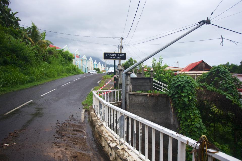 This photograph shows a fallen electrical tower in Trois-Riviere, on October 22, 2023, on the island of Guadeloupe, after the path of Hurricane Tammy. Confined for a few hours on October 21, 2023 in the path of Hurricane Tammy, Guadeloupe has not yet seen the last of the bad weather: heavy rains fell on the archipelago on October 22, swelling rivers that have burst their banks and causing local flooding.