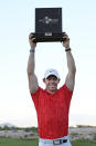 Rory McIlroy, of Northern Ireland, displays the trophy after winning the CJ Cup golf tournament Sunday, Oct. 17, 2021, in Las Vegas. (AP Photo/David Becker)