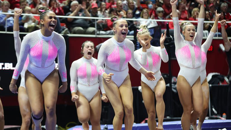 University of Utah gymnasts cheers their teammate on the beam in Salt Lake City on Friday, Feb. 23, 2024.