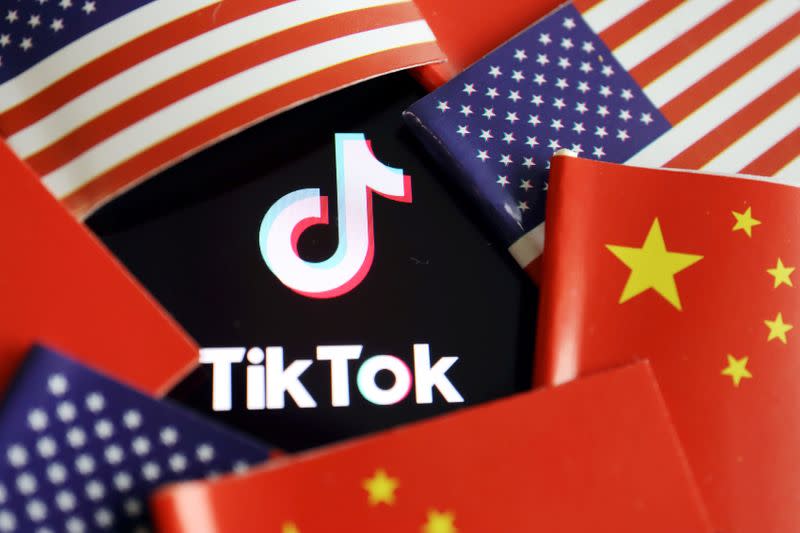 FILE PHOTO: Illustration picture of Tiktok with U.S. and Chinese flags