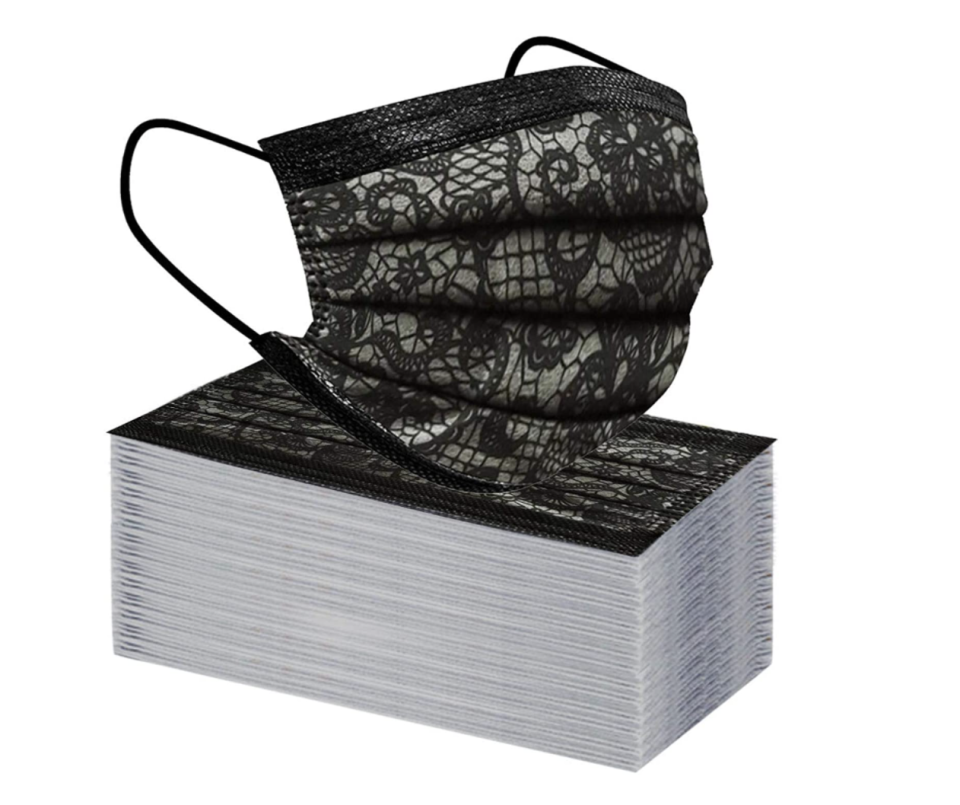 stack of Disposable Lace Printed Face Masks on white background