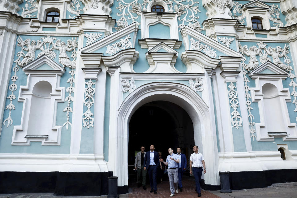 Ireland's Prime Minister Leo Varadkar, second from left, walks out of the bell tower of Saint Sophia's Cathedral in Sophia Square on the occasion of his visit to Kyiv, Ukraine, Wednesday July 19, 2023. (Clodagh Kilcoyne/Pool Photo via AP)