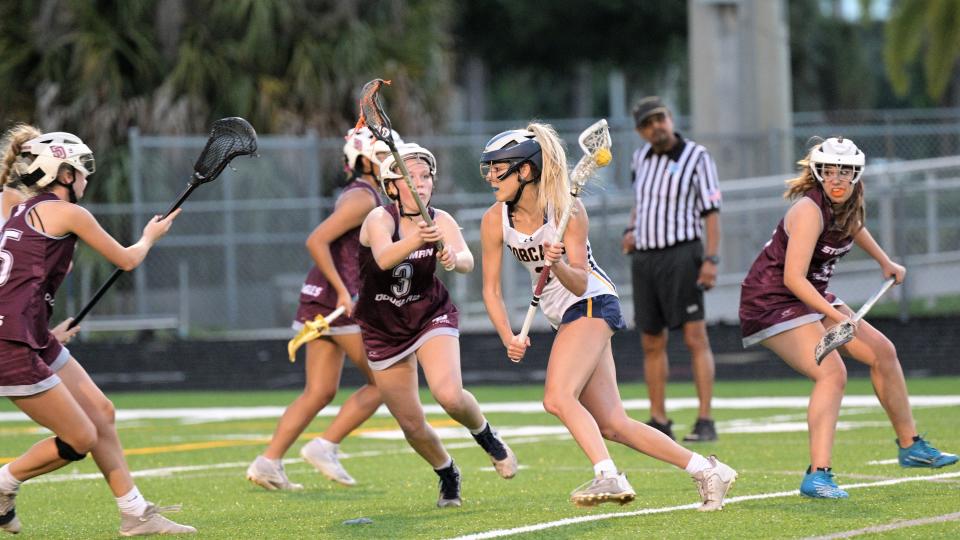 Boca Raton's Winnie Amelung cuts into the zone to fire a shot on goal during the first half of the April 25 regional semifinals action against Stoneman Douglas.