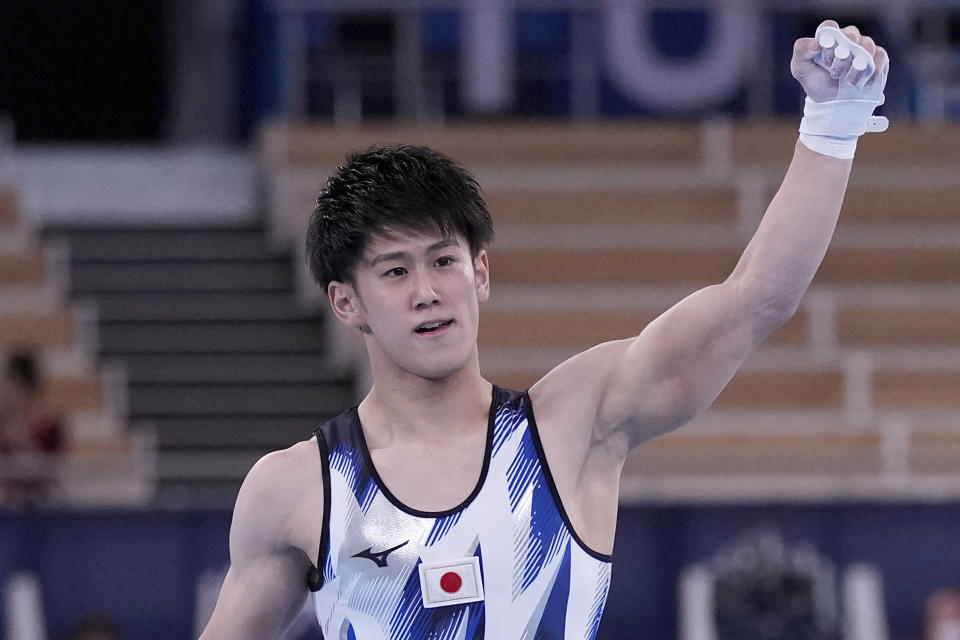 FILE - In this Aug. 3, 2021, file photo, Daiki Hashimoto, of Japan, celebrates after performing on the horizontal bar during the artistic gymnastics men's apparatus final at the 2020 Summer Olympics in Tokyo, Japan. The 50th artistic gymnastics world championships started Monday, Oct. 18, 2021 and will continue through Sunday in Kitakyushu, featuring more than 300 gymnasts representing 59 countries. (AP Photo/Ashley Landis, File)